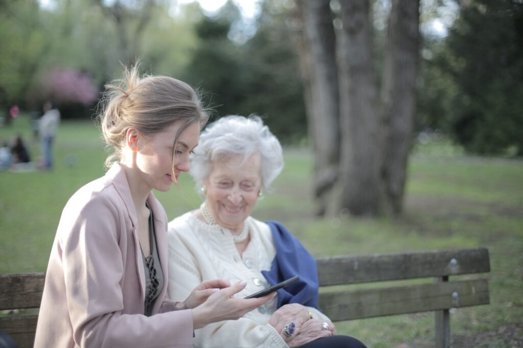 Senior woman and caregiver reviewing senior resources available in Polk County Iowa