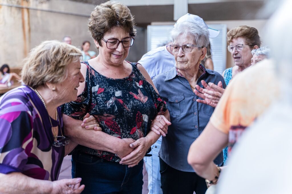 Caregiver helping an older adult at home while using senior resources in Polk County