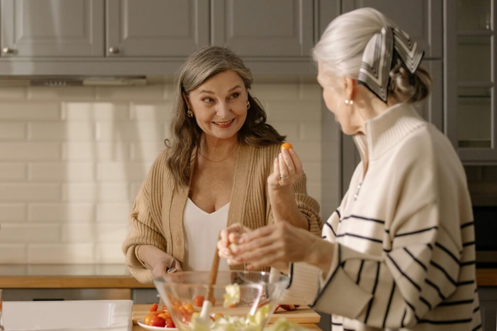 Caregiver helping senior with meal preparation in Iowa